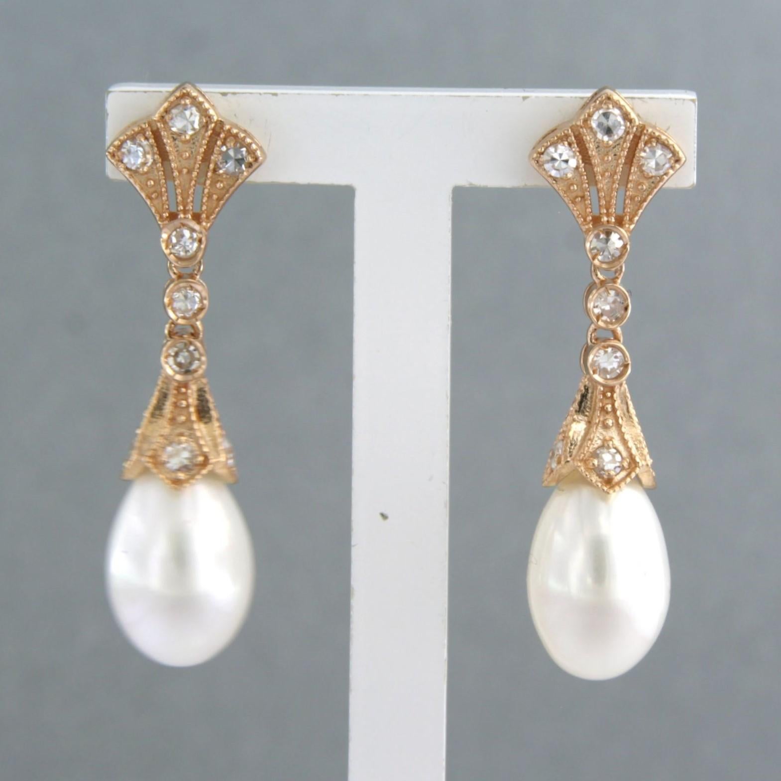 14k pink gold earrings set with pearl and single cut diamonds. 0.34ct - F/G - VS/SI

detailed description:

the size of the earring is 3.0 cm long by 7.3 mm wide

weight 4.7 grams

set with

- 2 x 1.1 cm x 7.3 mm drop shape freshwater pearl

colour