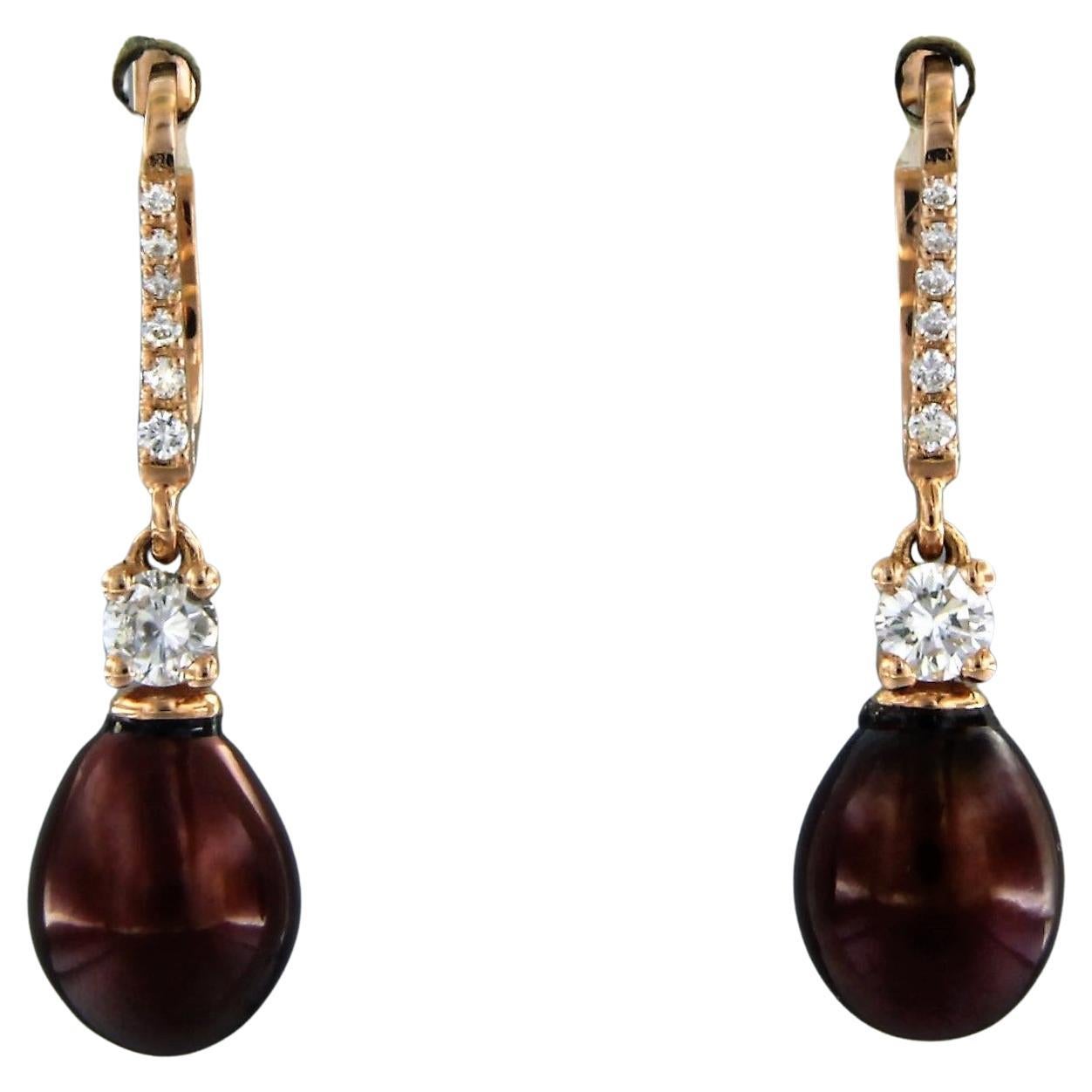 Ohrringe aus 18 Karat Roségold mit Perlen und Diamanten besetzt
