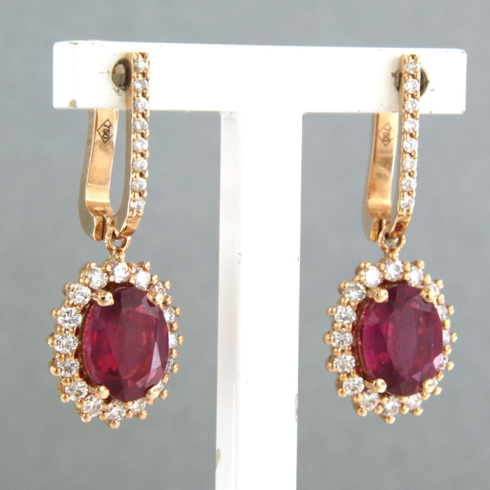 18k pink gold earrings set with ruby 3.20 ct and brilliant cut diamond 0.64ct - F/G - VS/SI

detailed description:

the size of the earrings is 2.6 cm high and 1.1 cm wide

Total weight 6.2 grams

set with

- 2 x 8.0 mm x 6.0 mm oval facet cut