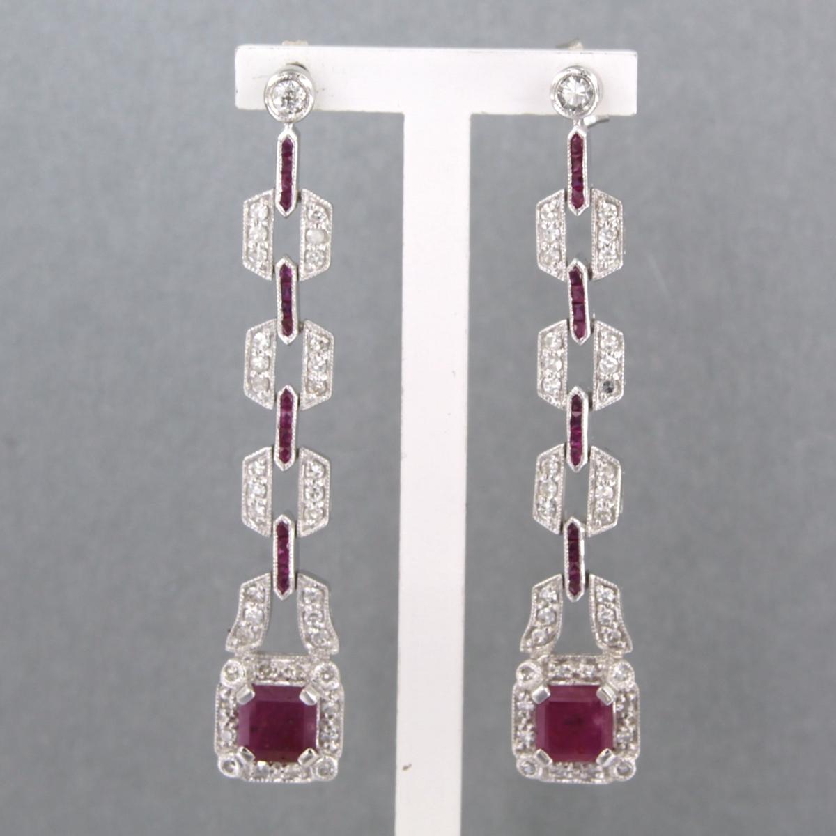 14k white gold earrings set with 3.50ct ruby, old mine cut and single cut diamonds up to. 1.04ct - F/G - VS/SI

detailed description:

The earrings are 8.3 cm high and 1.0 cm wide

weight: 9.5 grams

occupied with :

- 2 x 5.8 mm emmerald cut cut
