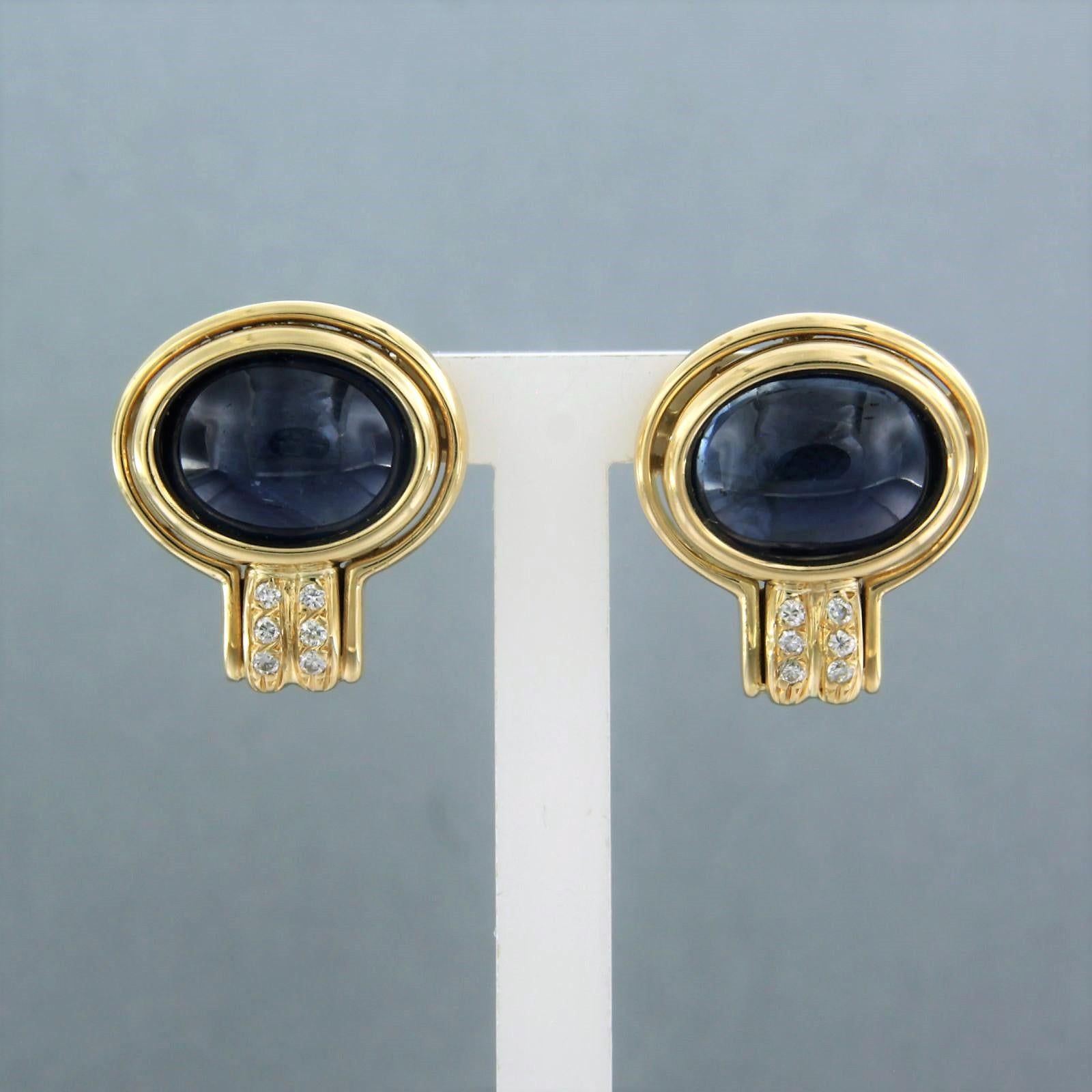 18k yellow gold stud earrings set with sapphire and brilliant cut diamonds. 0.12ct - F/G – VS/SI

Detailed description:

the size of the ear stud is 1.7 cm long by 1.5 cm wide

Total weight 10.4 grams

set with

- 2 x 1.0 cm x 7.6 mm oval cabachon