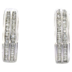 Earrings set with taper cut diamonds up to 1.00ct. 14k white gold