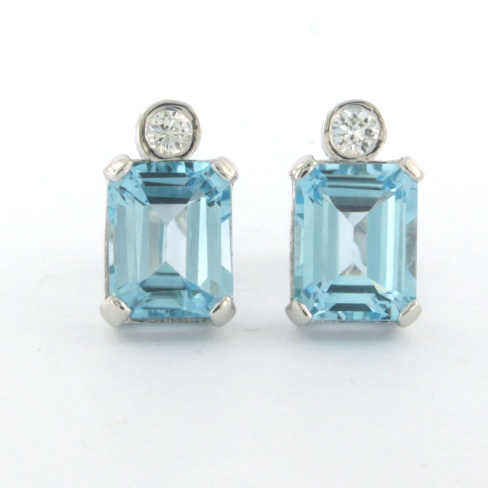 14k white gold ear studs set with topaz and brilliant cut diamond up to 0.20ct - F/G – VS/SI

Detailed description:

the size of the ear stud is 1.3 cm long by 8.0 mm wide

Total weight 3.8 grams

set with

- 2 x 9.4 x 7.4 mm emerald cut facet cut