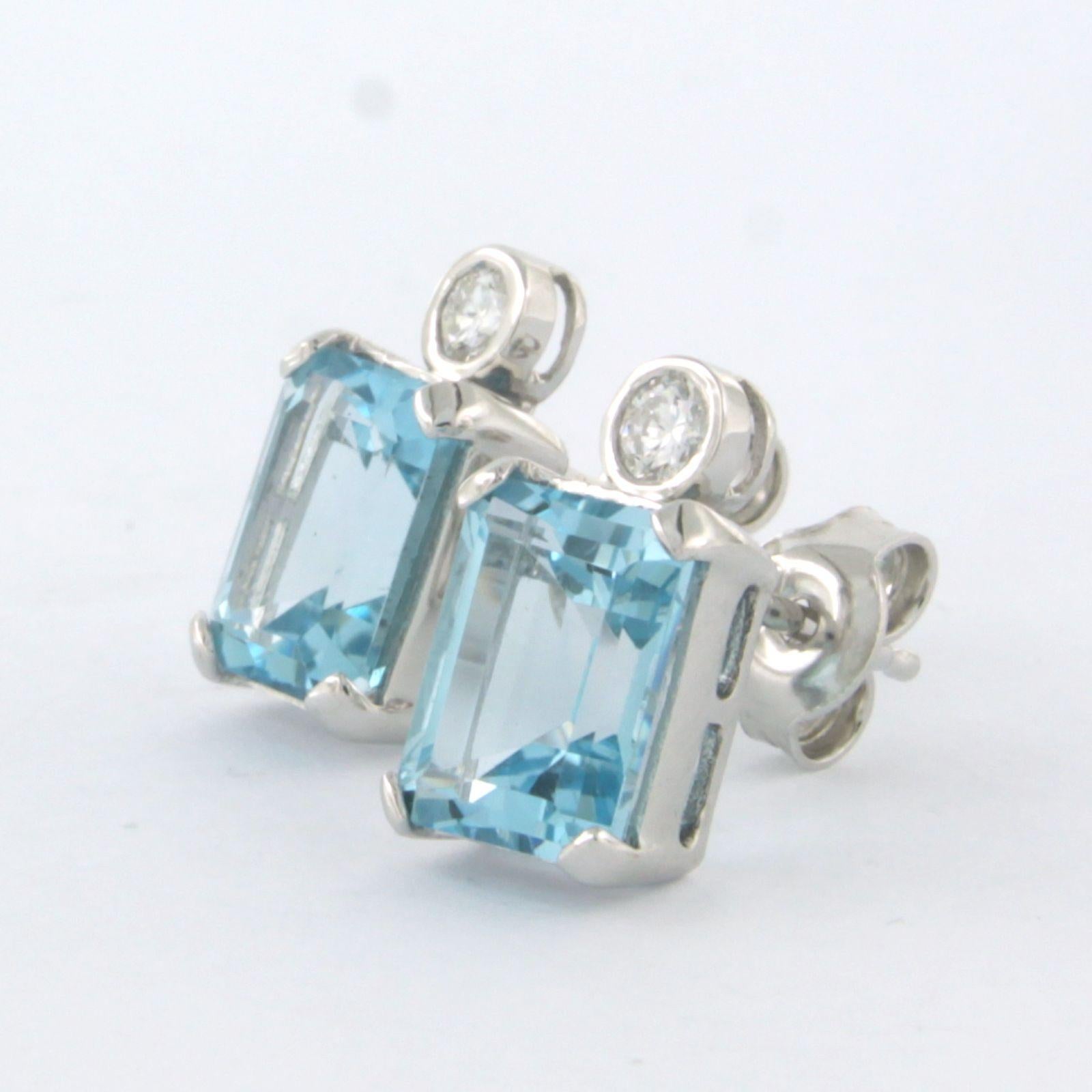 Women's Earrings set with topaz and diamonds 14k white gold