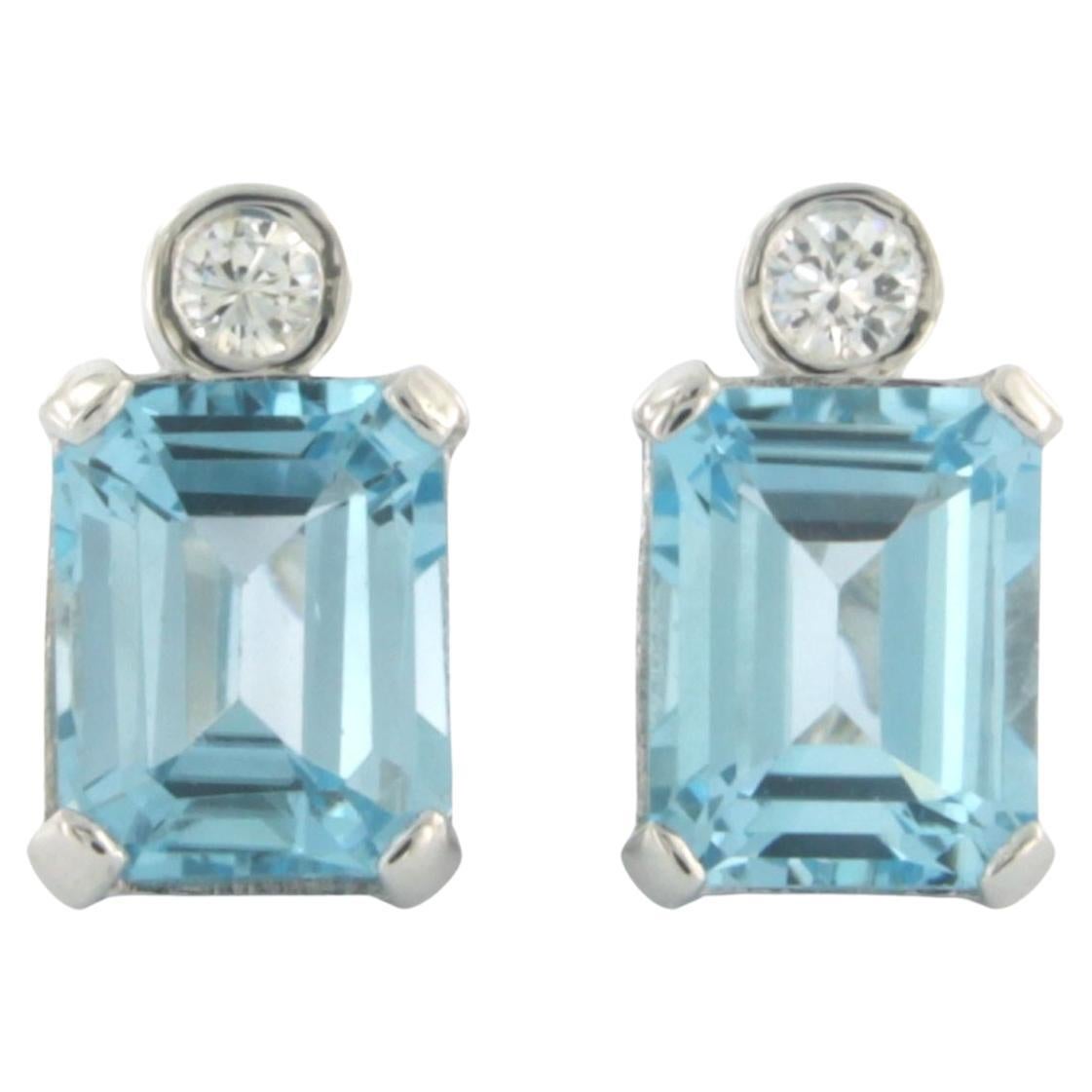 Earrings set with topaz and diamonds 14k white gold