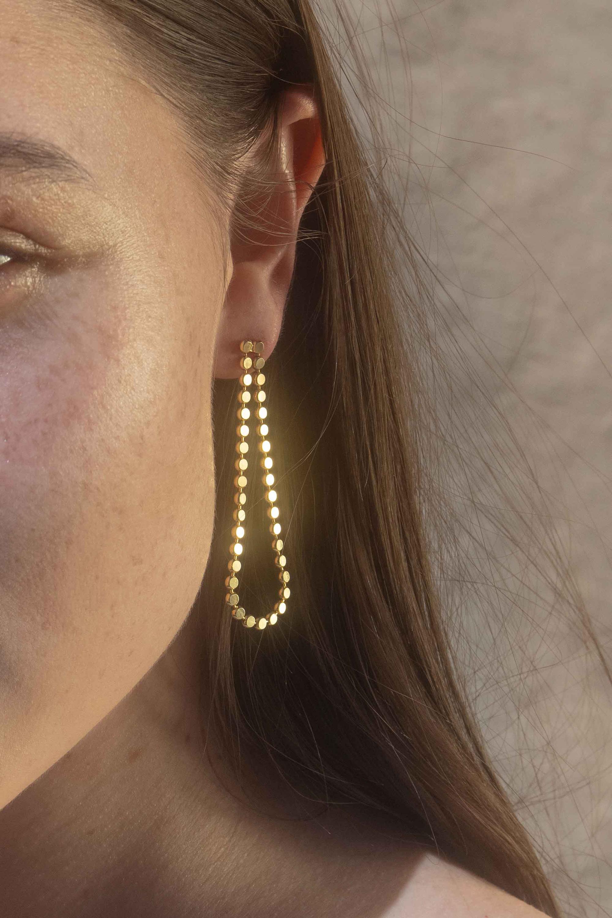 Alegria single Drop ( only front)

These 18k gold plated  earrings are available in 4 different ways.( exaple in pictures). The price listed is for the single  one. Wear just the front for an easy everyday look or add the back drop and dress to