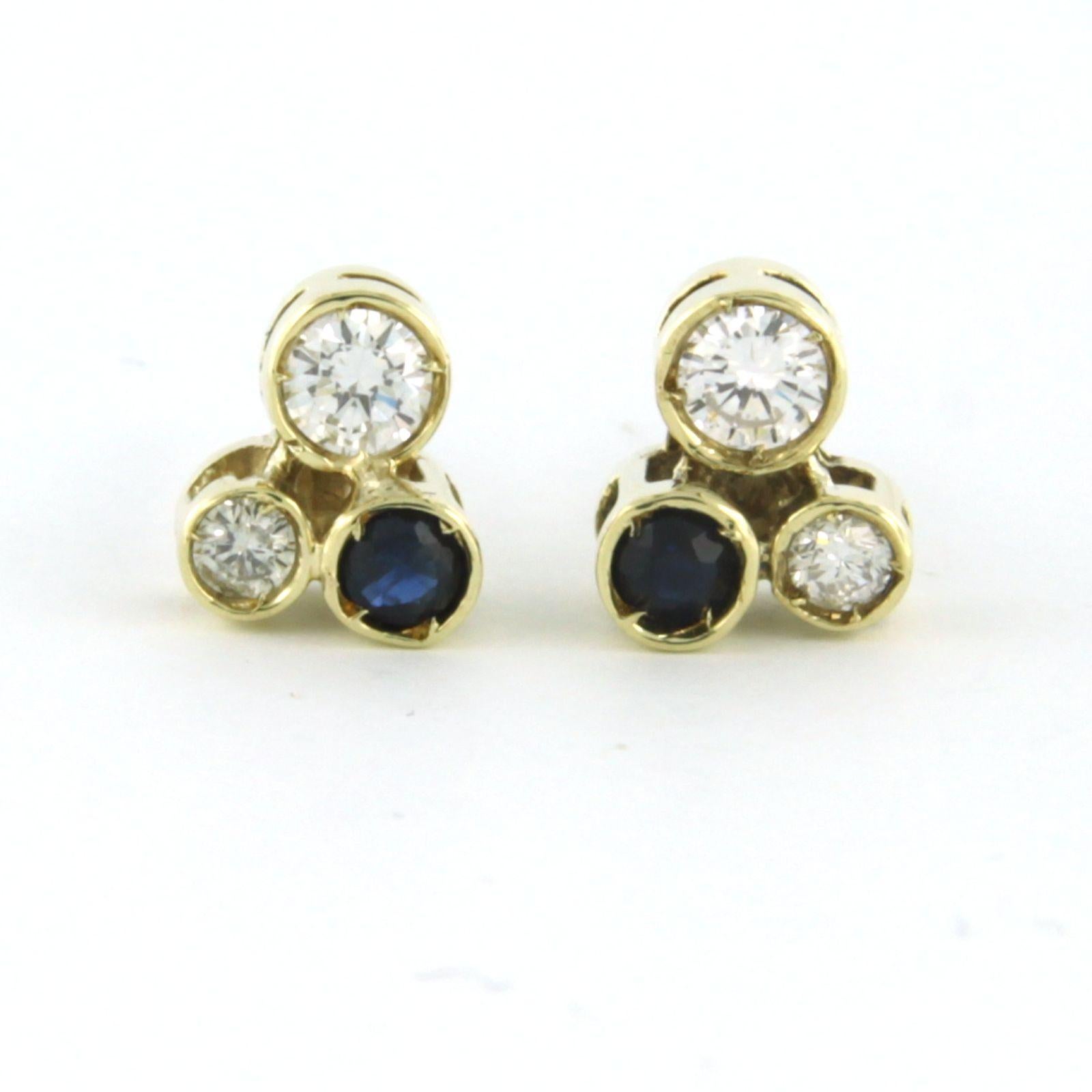 14k yellow gold stud earrings set with sapphire and brilliant cut diamonds. 0.40ct - G/H - VS/SI

detailed description:

the top of the ear stud is 7.6 mm by 6.6 mm wide

weight: 2.2 grams

occupied with :

- 2 x 3.2 mm round facet cut heated