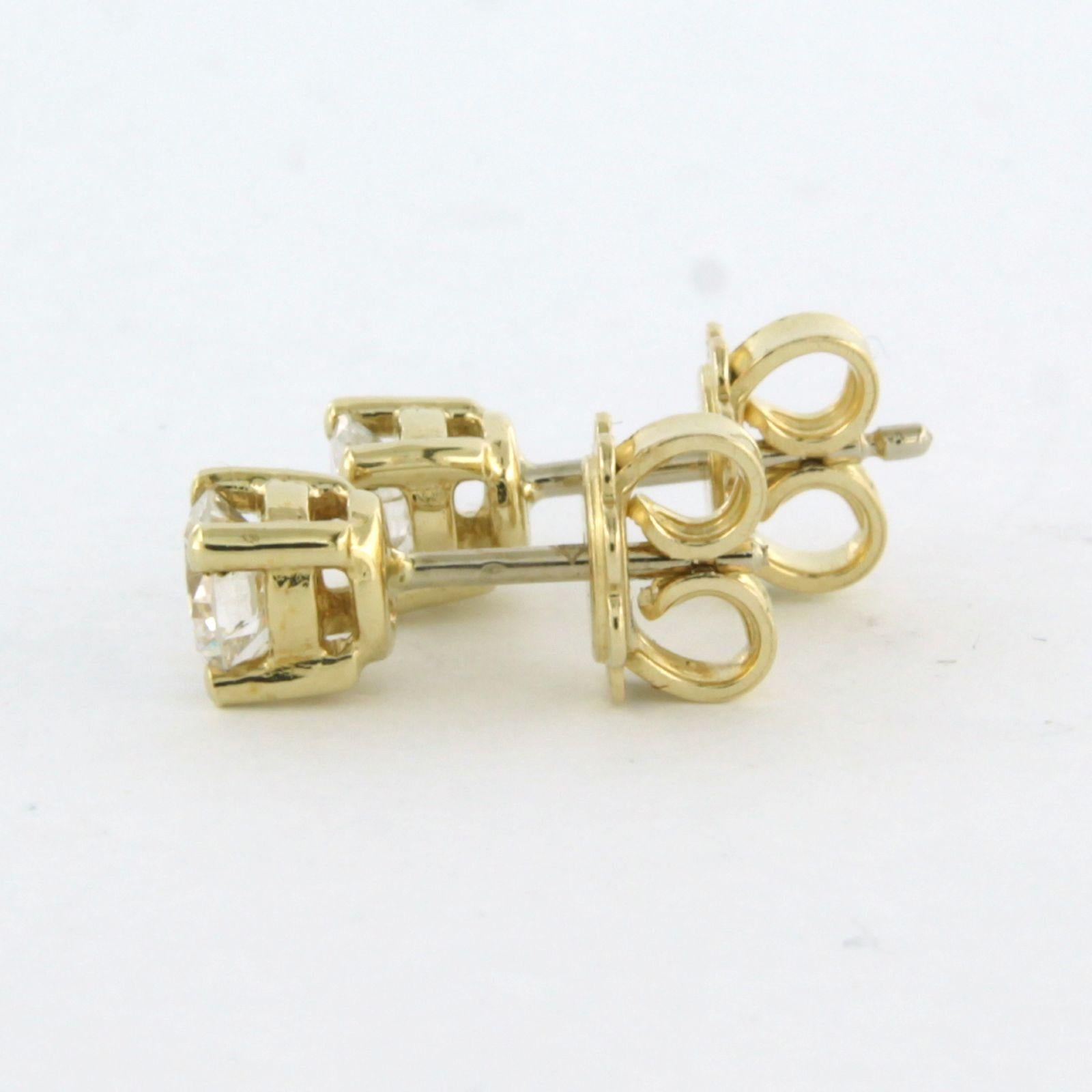 Earrings studs set with diamonds 14k yellow gold 1