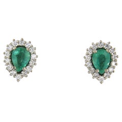Earrings studs set with emerald and diamonds 18k white gold