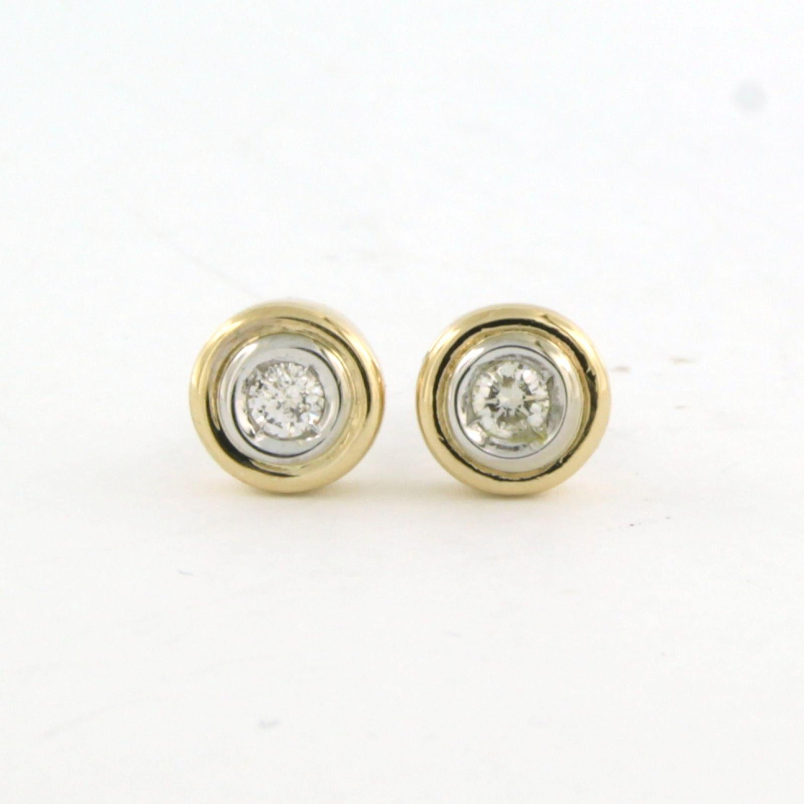 14k bicolour gold solitaire stud earrings with brilliant cut diamond up to 0.14ct - F/G – SI

Detailed description:

the diameter of the stud is 6.7 mm wide

Total weight 2.7 grams

set with

- 2 x 2.7 mm brilliant cut diamond total approximately