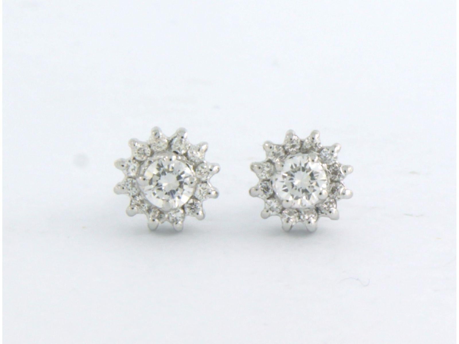 18k white gold stud earrings set with brilliant cut diamonds up to. 0.38ct - F/G - VS/SI

detailed description

the size of the ear stud is 6.5 mm wide

weight 1.9 grams

set with

- 2 x 3.2 mm brilliant cut diamond, approximately 0.24 carats in