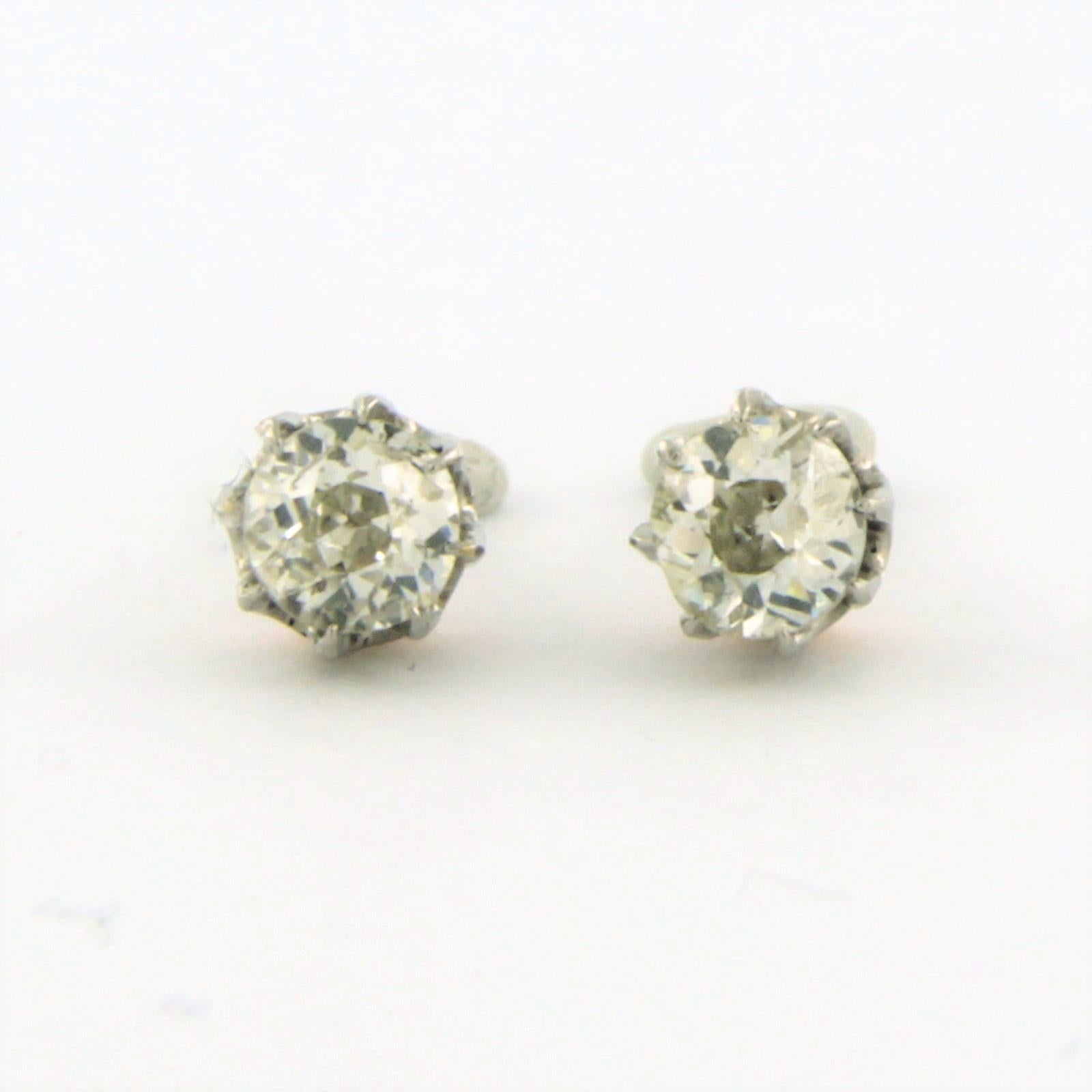 18k bicolour gold solitaire earrings set with old mine cut diamonds. 0.80ct - J/K - VS/SI

detailed description:

the top of the ear stud is 5.2 mm wide

weight 2.2 grams

set with

- 2 x 4.6 mm old mine cut diamond, approximately 0.80 carats in