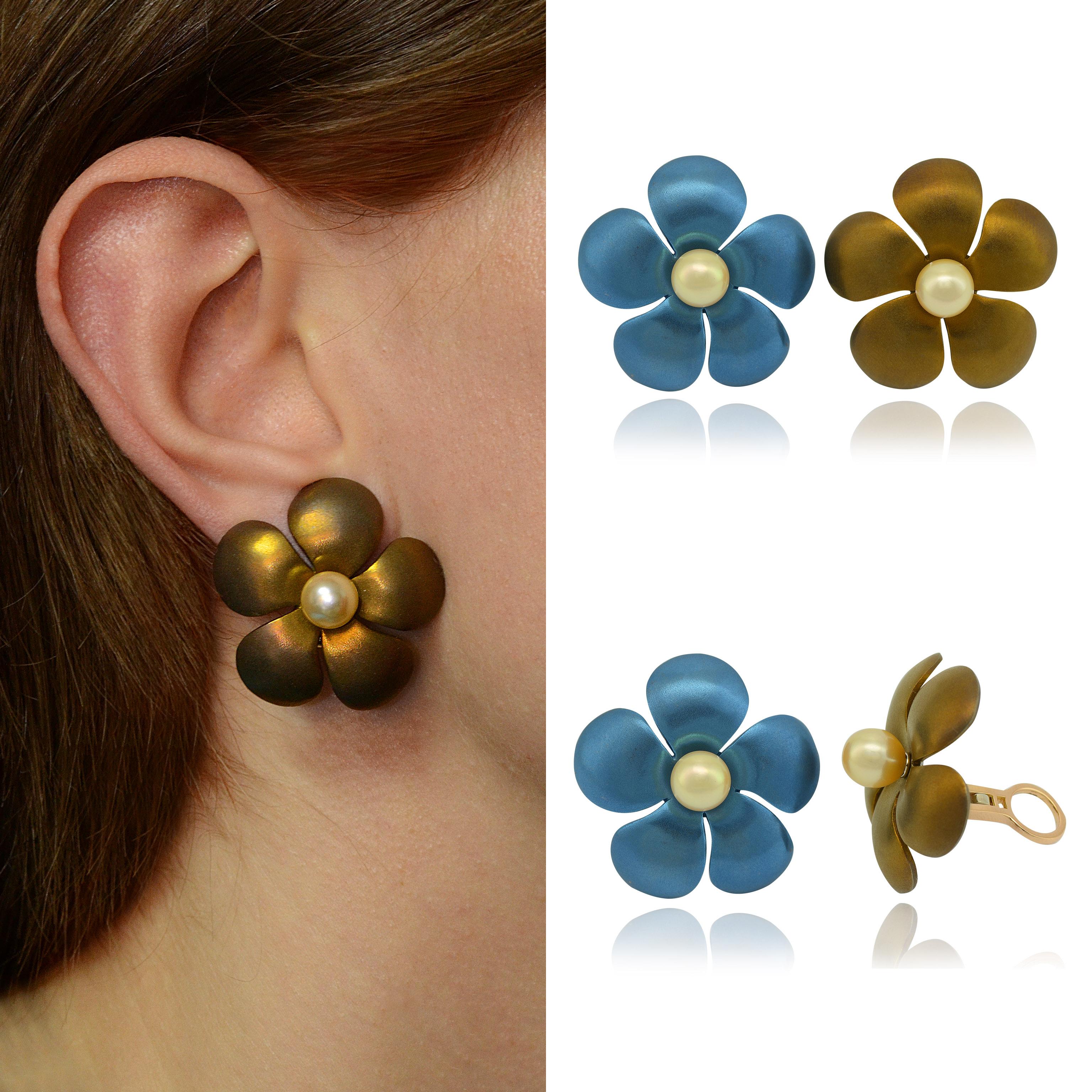 Very light titanium handmade mismatching earclips. 
They have a consistent clip in gold and fit for no pierced ears.
It is possible to add the fitting post for pierced ears. 
One earclips is sanitated blue and the other one is sanitated light brown,