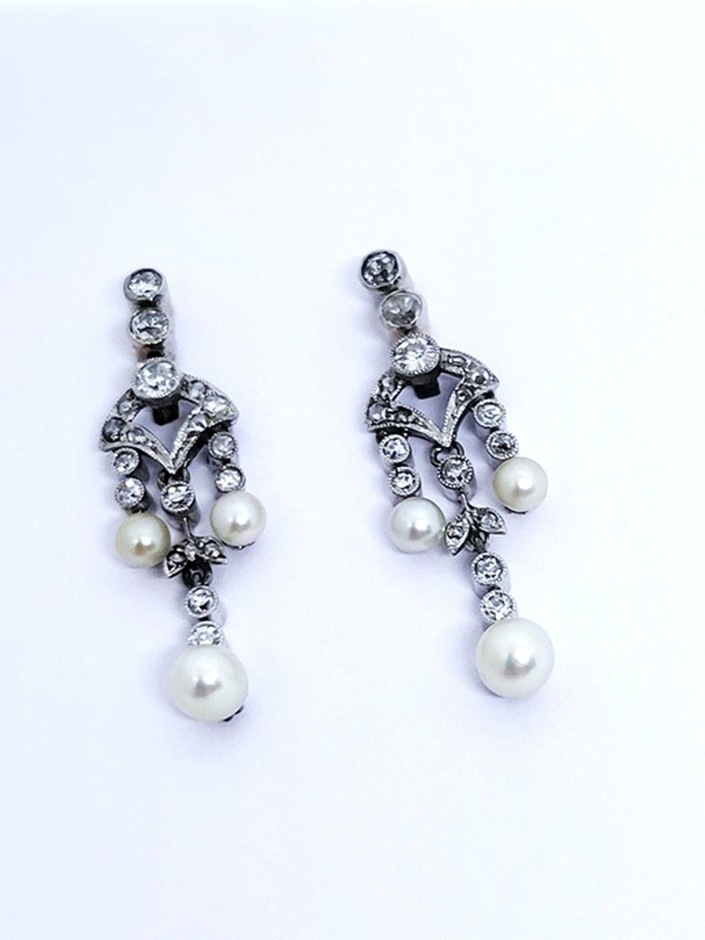 These finely crafted delicate Edwardian earrings from ca. 1910 are perfect for a sophisticated lady. Sparkling rose cut diamonds, set in white gold complement lustrous seed pearls in a beautiful garland style combination.
With these unique and