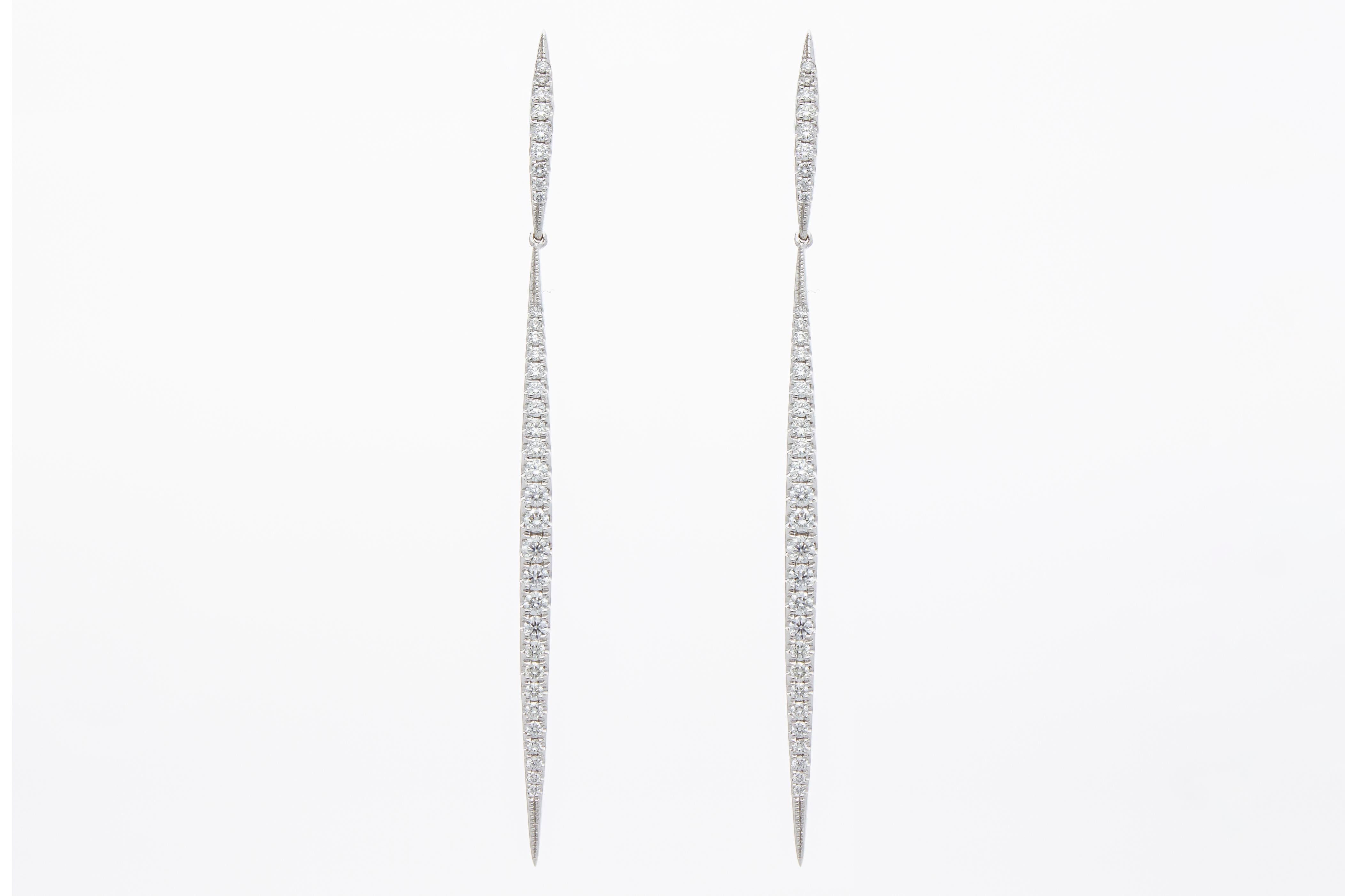 The very elegant pendant model earrings are formed by two bars on which sixty-eight (68) diamonds are set in gradations, their total carat weight is 0.74 ct. 
The earrings are in 18 Kt white gold. 
The earrings have the carat weight of the diamonds