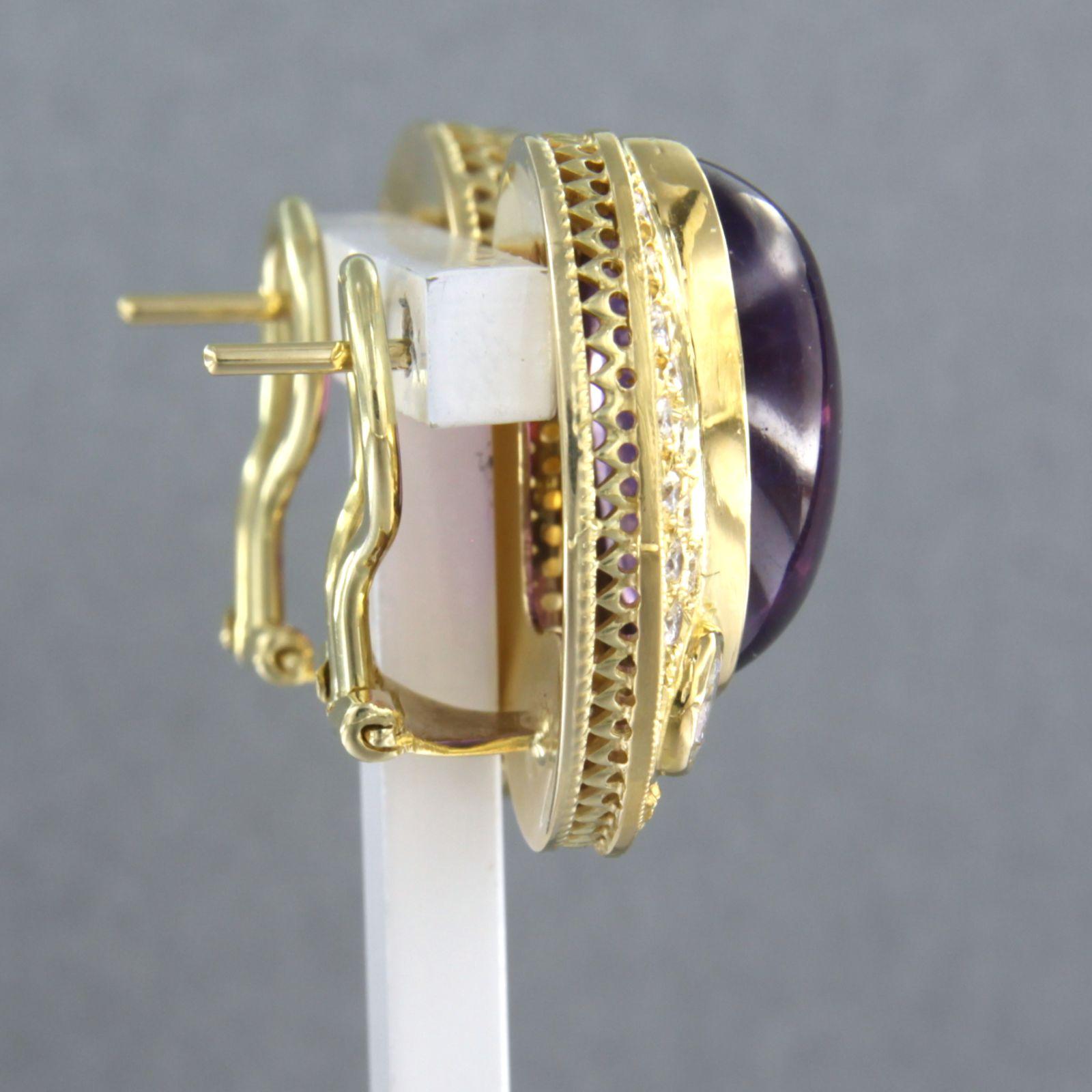 14k yellow gold clip earrings set with amethyst and brilliant cut diamond up to 1.40ct - F/G - VS/SI

detailed description

the top of the clip earrings is 2.2 cm long by 1.8 cm wide

total weight is 15.6 grams

set with

- 2 x 1.7 cm x 1.2 cm oval