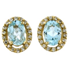 Earrings with blue topaz and diamonds 14k yellow gold