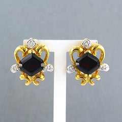 Earrings with garnet and brilliant cut diamonds up to 0.06ct 18k gold 8.9 grams