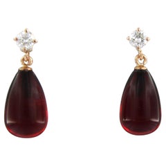 Earrings with garnet and brilliant cut diamonds up to 0.36ct - 2.4 gram 18k gold