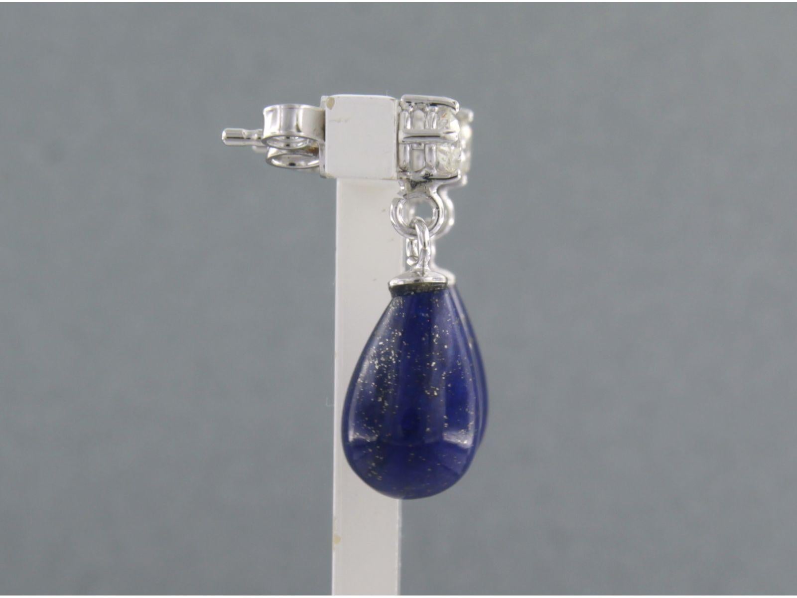 18k white gold earrings set with lapis lazuli and brilliant cut diamonds. 0.36ct - F/G - VS/SI

detailed description:

the size of the earring is 2.2 cm long by 8.2 mm wide

total weight: 4.2 grams

occupied with:

- 2 x 1.0 cm x 8.2 mm drop shape