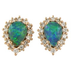 Boucles d'oreilles avec opale et diamants taille brillant jusqu'à 0,52ct Or rose 18k