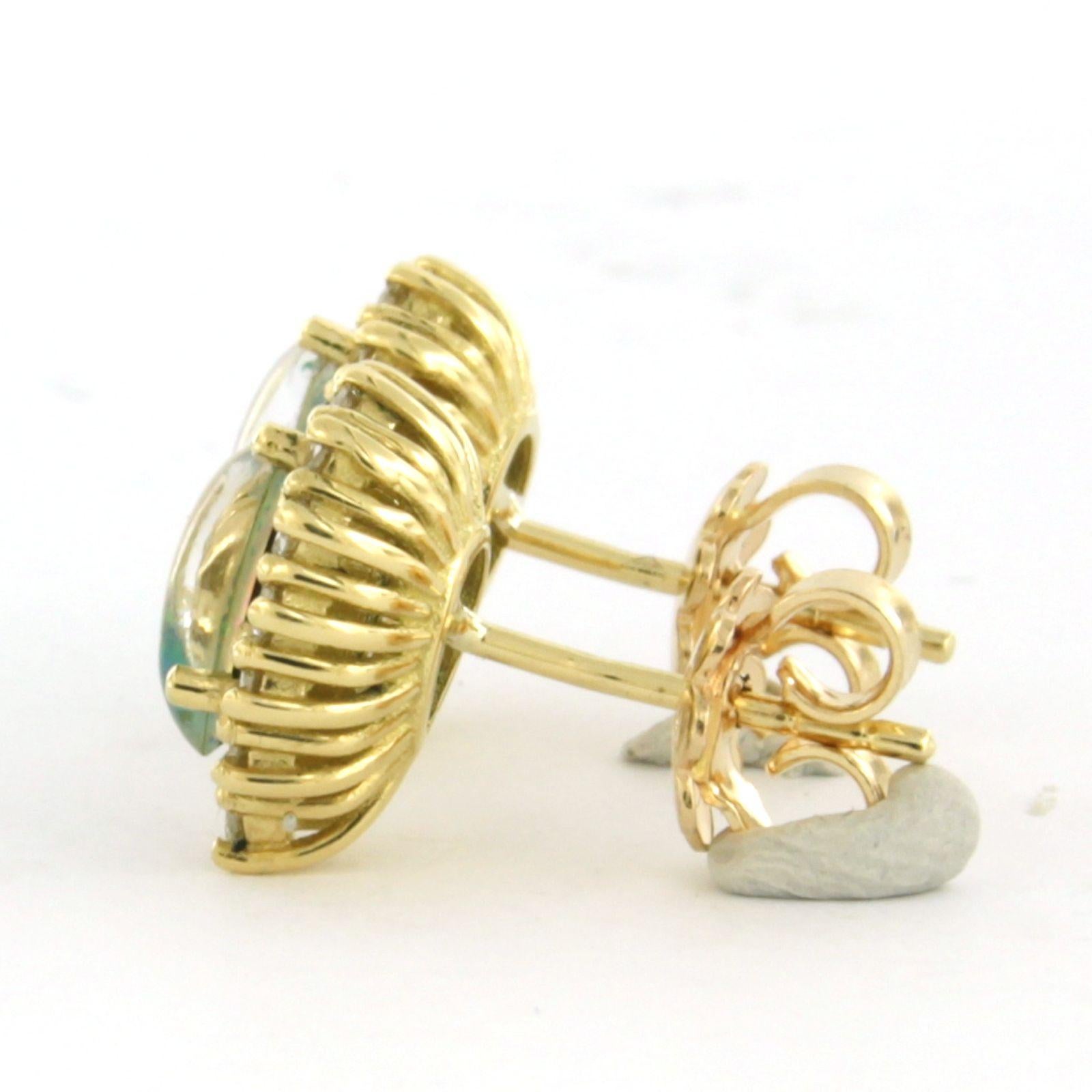 Ohrstecker aus 18 Karat Gelbgold mit Opal und Diamanten im Brillantschliff von bis zu 0,52 Karat - F/G - VS/SI

Ausführliche Beschreibung:

Die Ohrstecker sind 1,1 cm lang und 9,3 mm breit.

Gesamtgewicht: 4,4 Gramm

Satz mit

- 2 x 7,5 mm x 5,2 mm