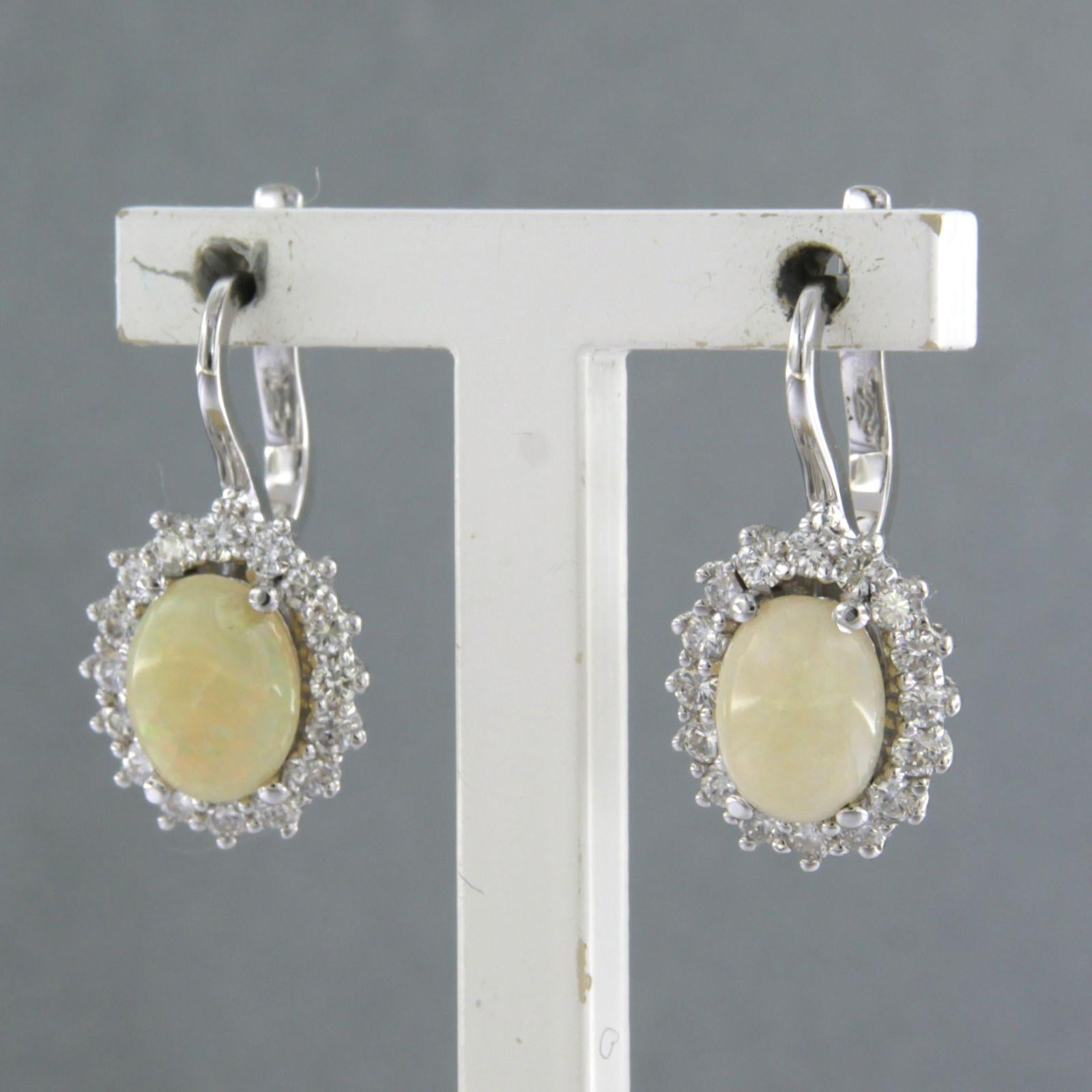 Earrings with opal and brilliant cut diamonds up to 0.64ct 18k gold 5.1 grams en Nuevo estado para la venta en The Hague, ZH