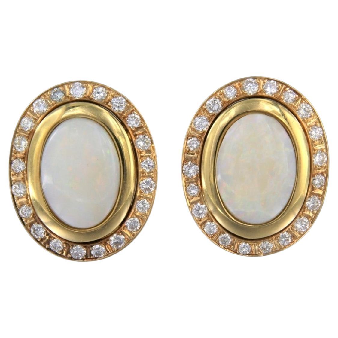 Earrings with opal and brilliant cut diamonds up to 1.00ct 12.1 grams 14k gold