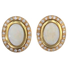 Earrings with opal and brilliant cut diamonds up to 1.00ct 12.1 grams 14k gold