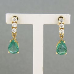 Earrings with pear shape emerald and brilliant cut diamonds 18k yellow gold