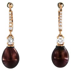 Boucles d'oreilles avec perle et diamants taille brillant jusqu'à 0,32ct Or rose 18k