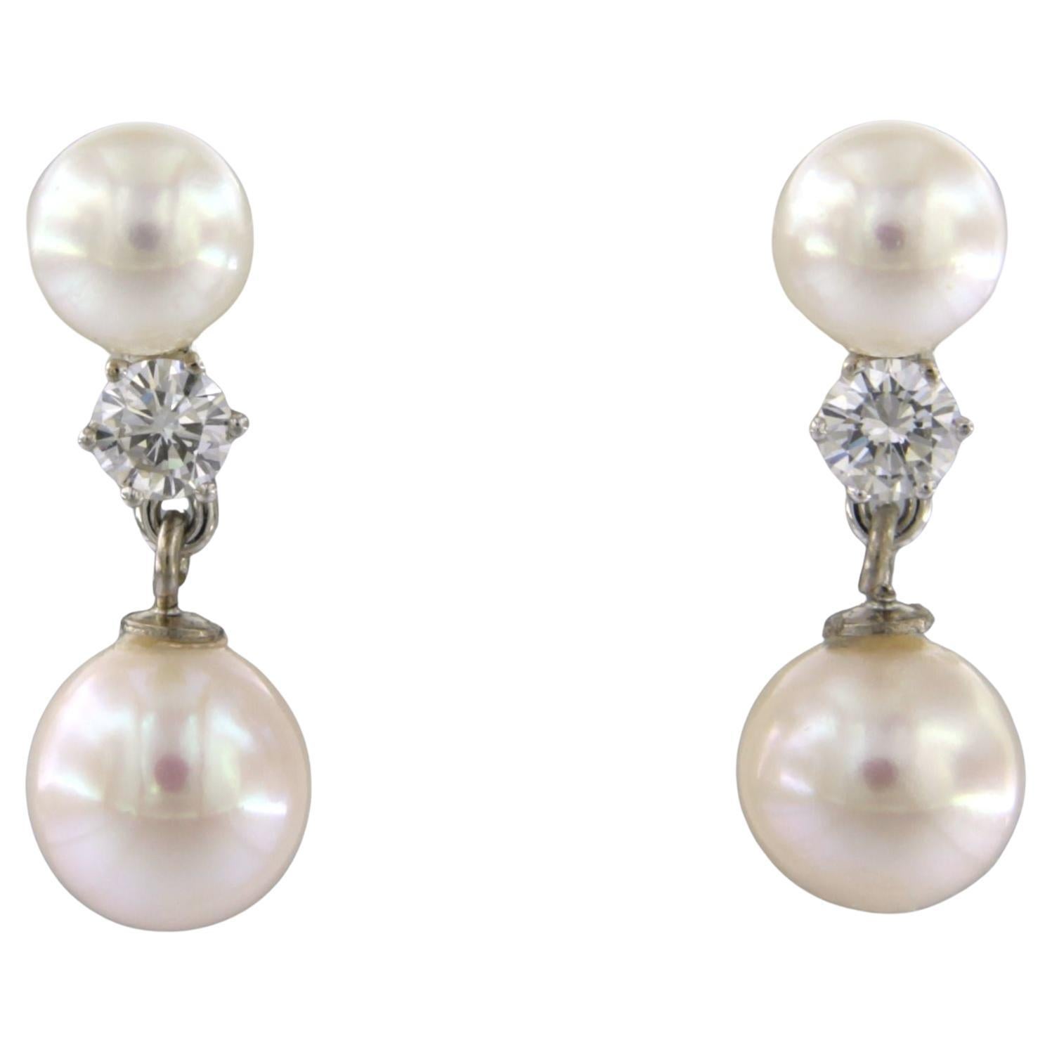 Orecchini con perla e diamanti taglio brillante fino a 0,50ct in oro 14k 4,8 grammi