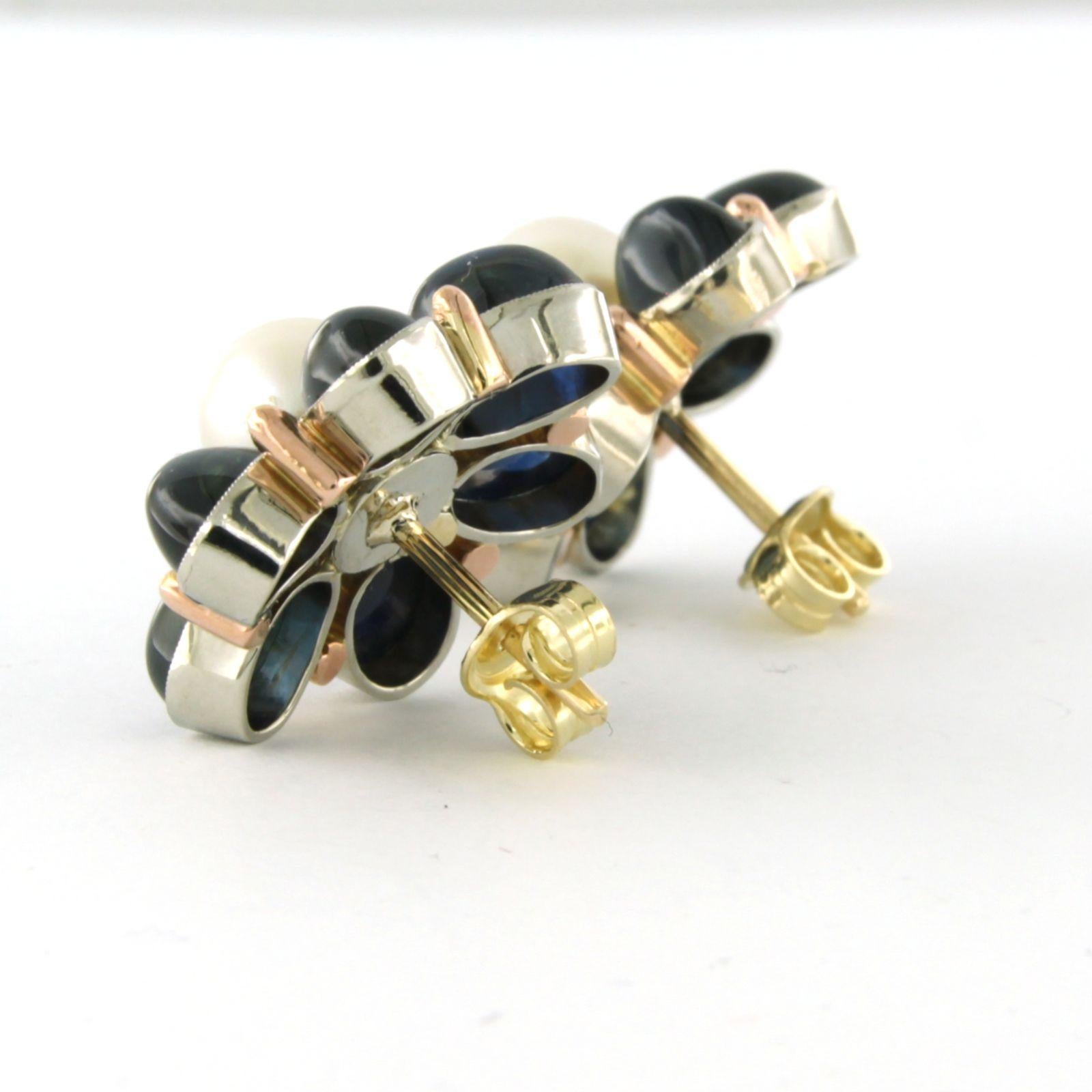 14k bicolour gold stud earrings set with pearl and sapphire

Detailed description:

The earrings have a diameter of 2.1 cm

Total weight 10.8 grams

set with

- 2 x 8.0 mm freshwater cultured pearls

colour: white
clarity: n/a

- 12 x 7 mm x 5 mm