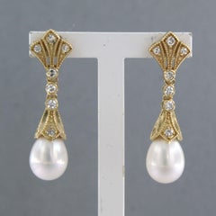 Earrings with pearl and single cut diamonds up to 0.32ct 14k yellow gold