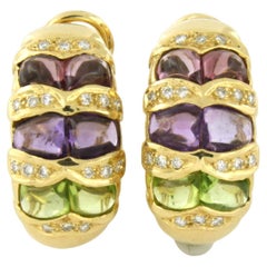Earrings with peridot, amethyst and brilliant cut diamonds up to 0.20ct 14k gold