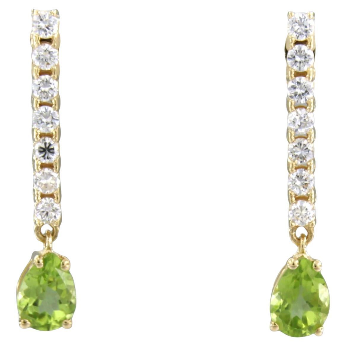 Orecchini con peridoto e diamanti taglio brillante fino a 0,58ct in oro 18k 3,4 grammi