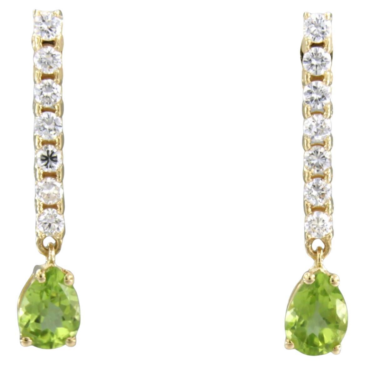 Earrings with peridot and brilliant cut diamonds up to 0.58ct 18k gold 3.4 grams