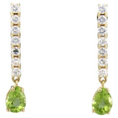 Earrings with peridot and brilliant cut diamonds up to 0.58ct 18k gold 3.4 grams