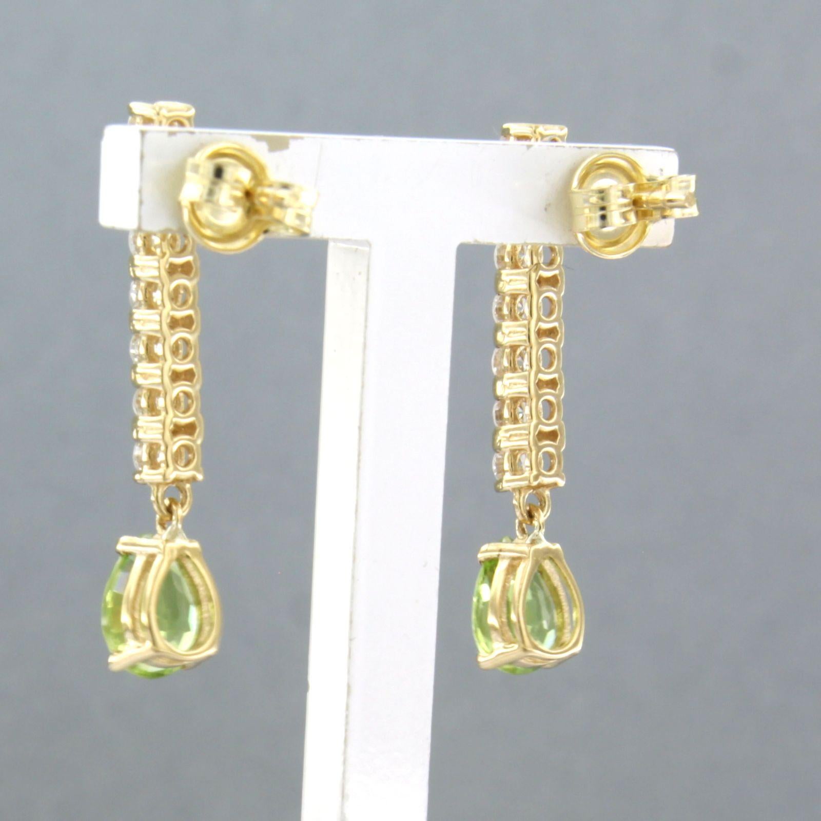 Earrings with peridot and brilliant cut diamonds up to 0.58ct 18k yellow gold In New Condition For Sale In The Hague, ZH
