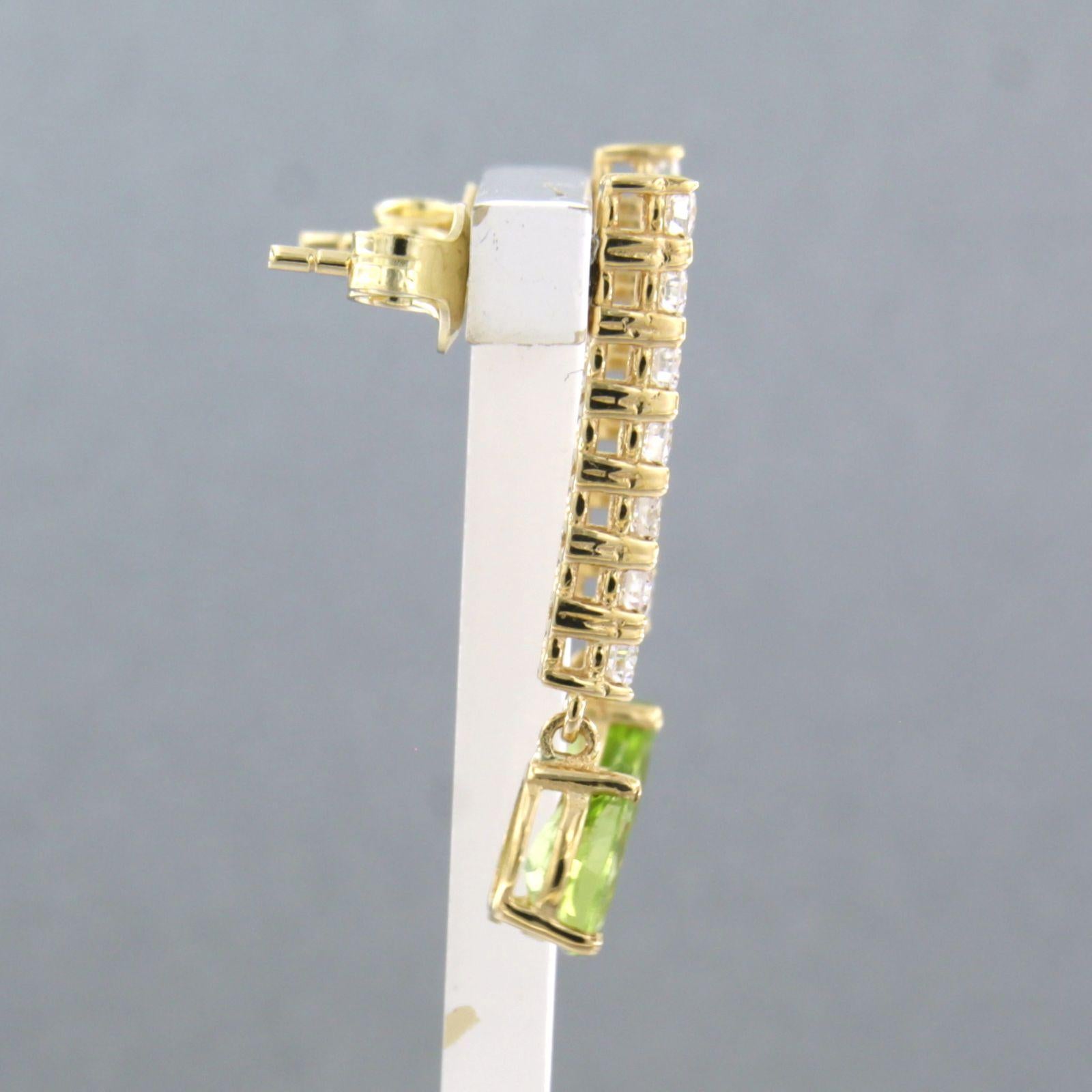 Women's Earrings with peridot and brilliant cut diamonds up to 0.58ct 18k yellow gold For Sale