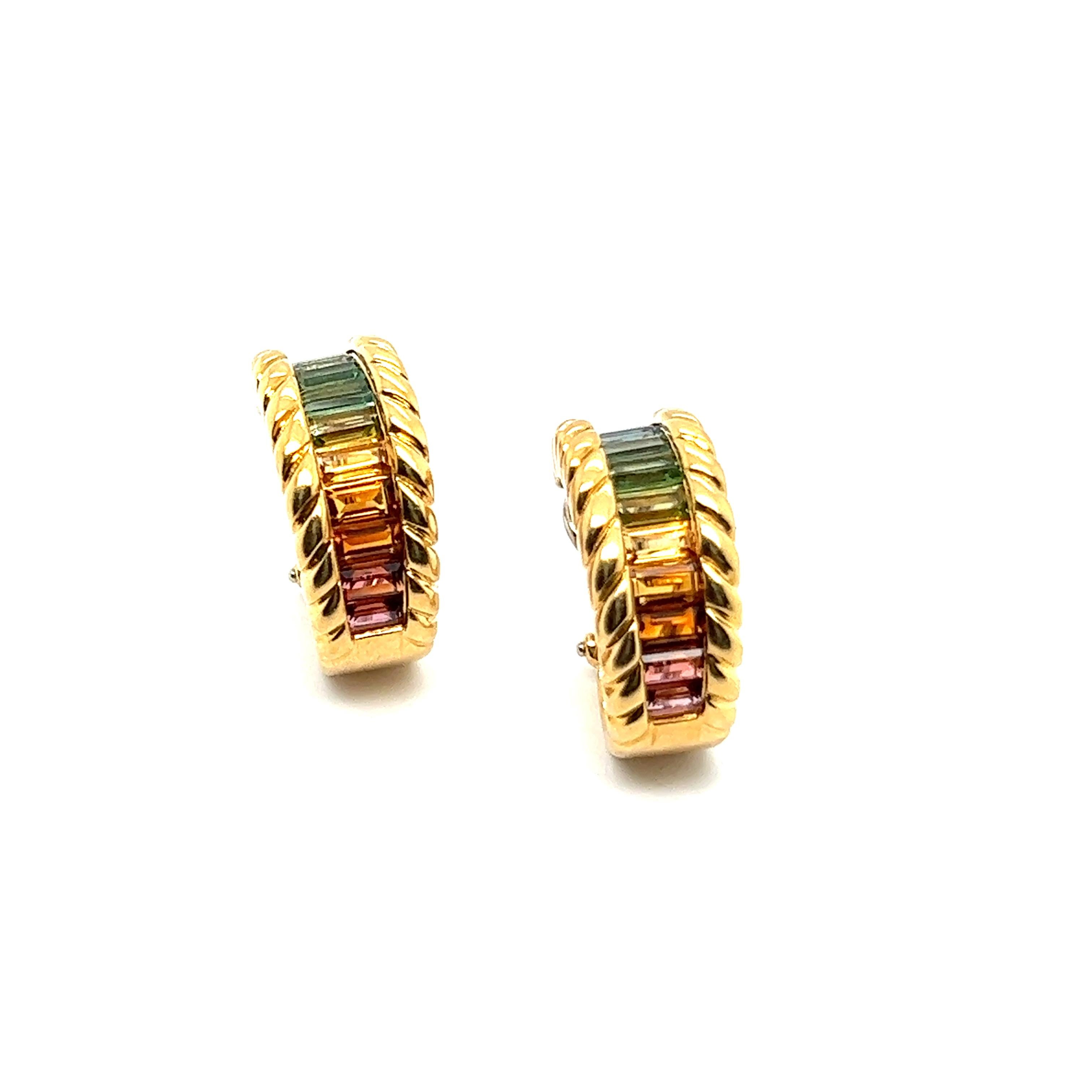 Introducing  exquisite earrings with rainbow gemstones in 18 Karat yellow gold by Gübelin. 

This colorful piece seamlessly fuses modern design with the enchanting allure of 22 baguette-cut rainbow gems. Tourmaline, aquamarine, amethyst, citrine -