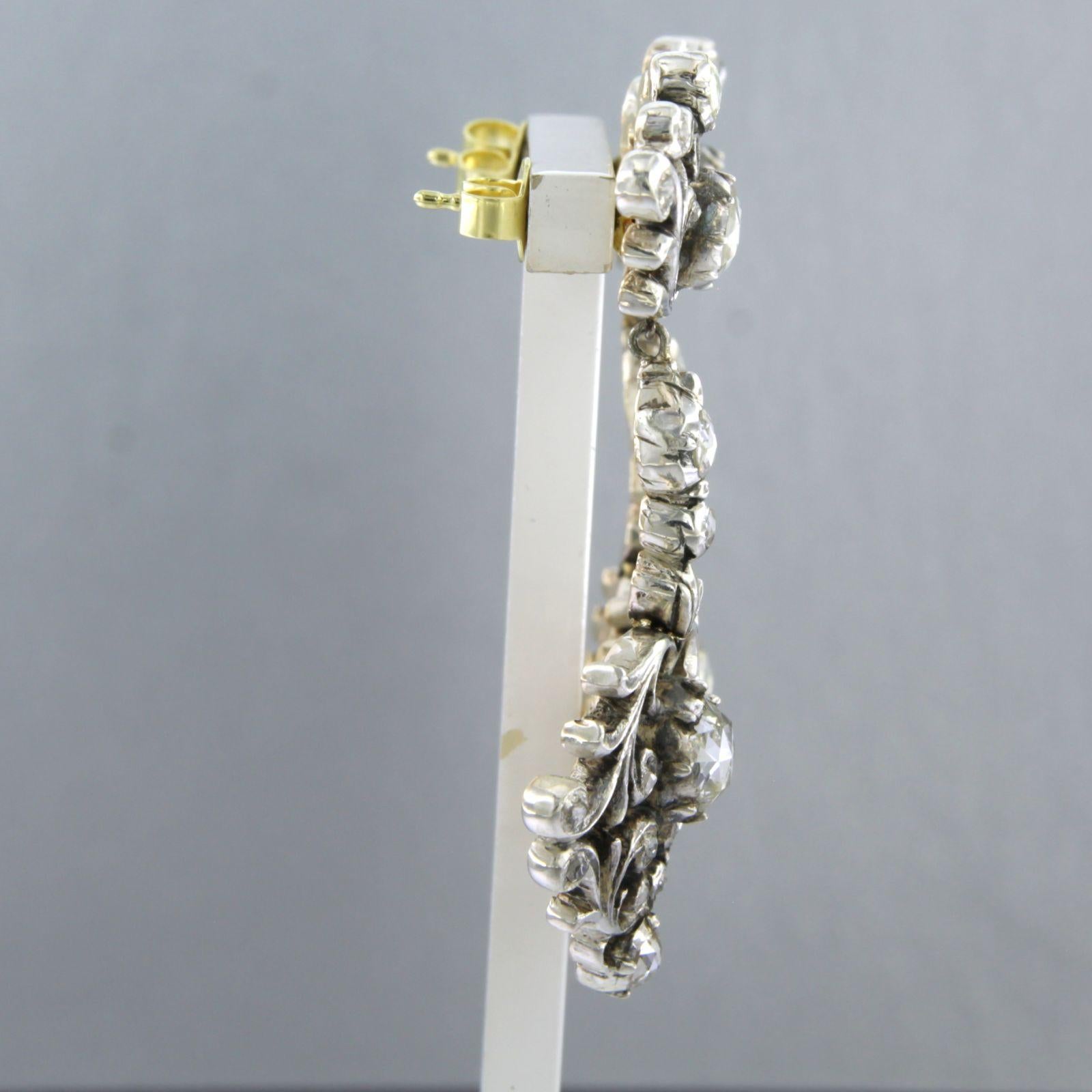 14k gold and silver earring set with rose-cut diamonds, totaling approximately 2.00 ct G/H SI

Detailed description:

The earring measures 4.2 cm high by 2.2 cm wide

Total weight: 17.1 grams

Set with

- 46 x 5.0 mm - 1.5 mm rose-cut diamonds,