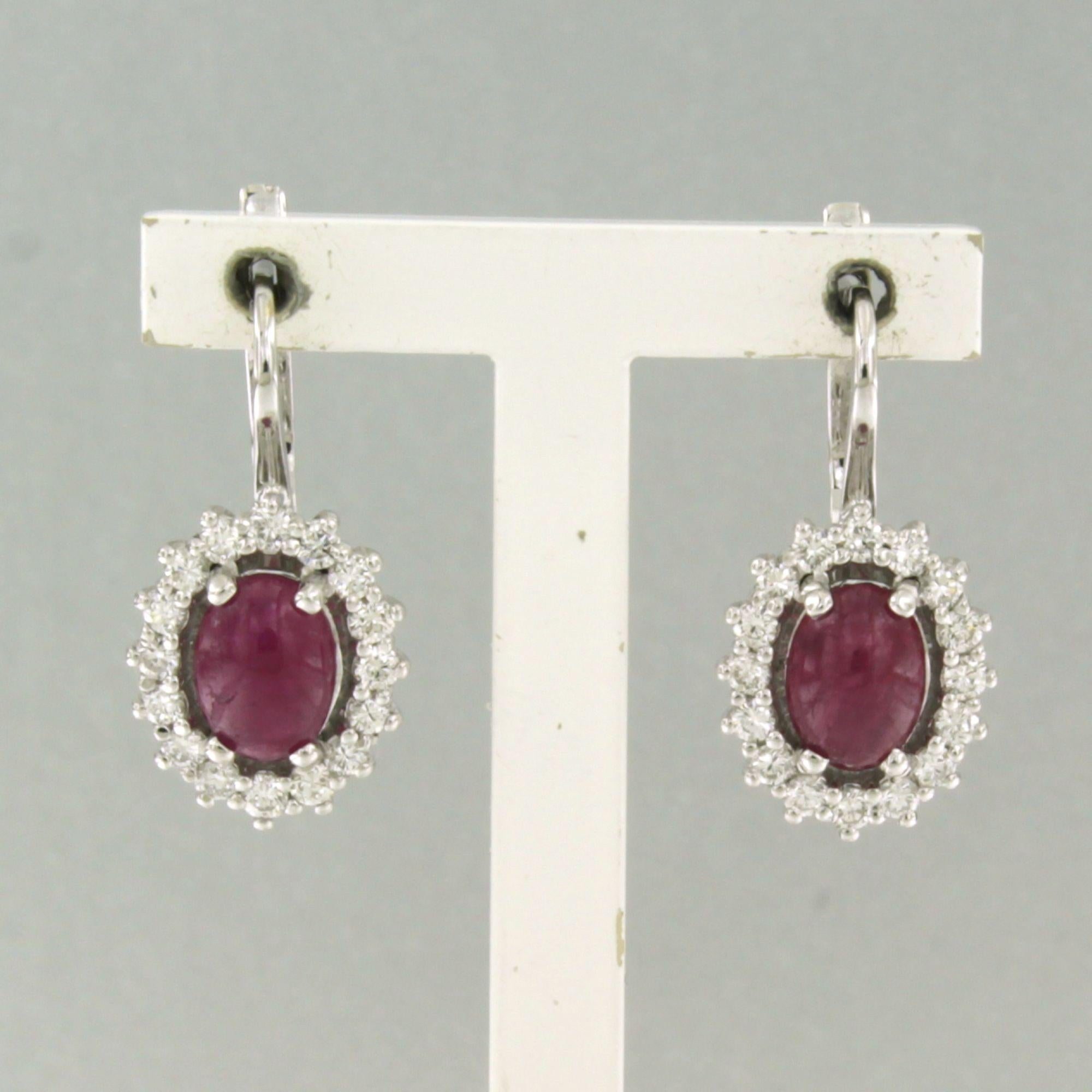Earrings with ruby and brilliant cut diamonds up to 0.92ct 18k white gold For Sale