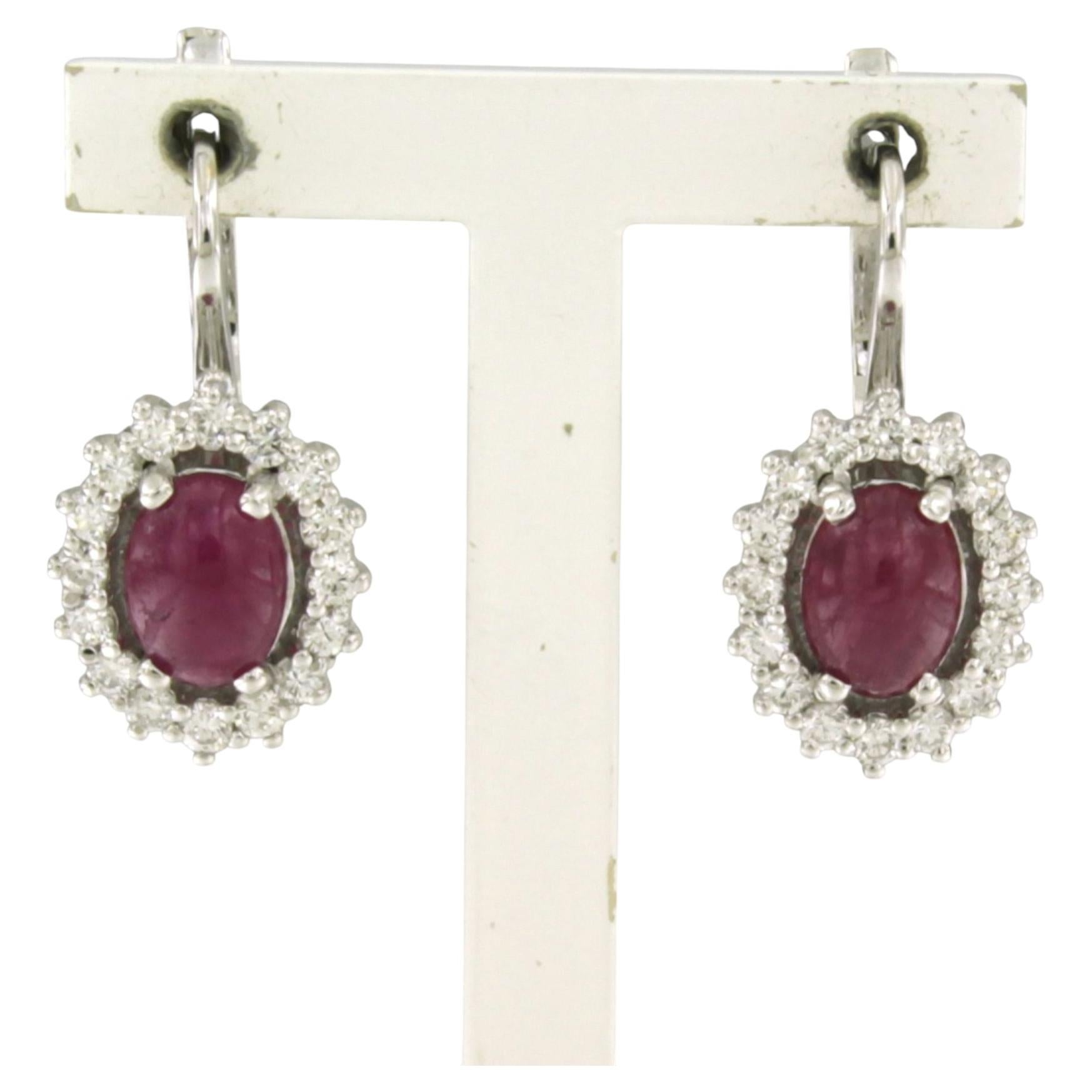 Earrings with ruby and brilliant cut diamonds up to 0.92ct 18k white gold For Sale
