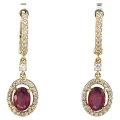 Earrings with ruby up to 1.70ct and brilliant cut diamonds up to 0.41ct 14k gold
