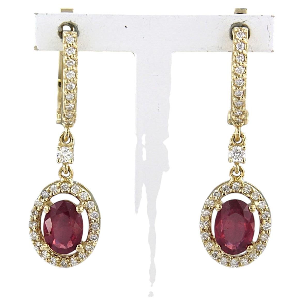 Earrings with ruby up to 1.70ct and brilliant cut diamonds up to 0.41ct 14k gold