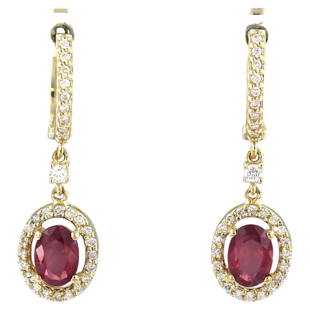 Earrings with ruby up to 1.70ct and brilliant cut diamonds up to 0.42ct 14k gold