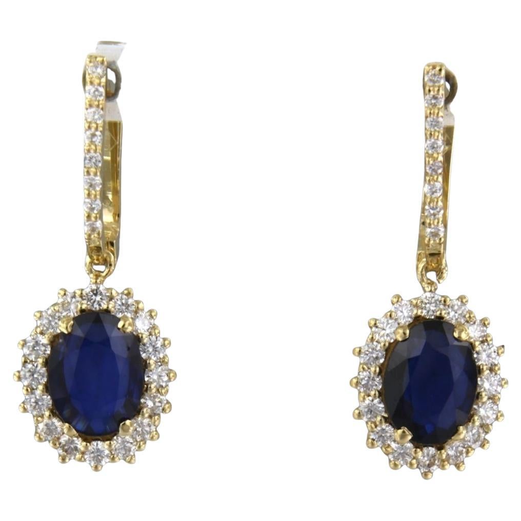 Earrings with sapphire and brilliant cut diamonds up to 0.72ct 18k gold