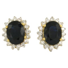 Earrings with sapphire to 3.60ct and brilliant cut diamond up to 0.50ct 18k gold