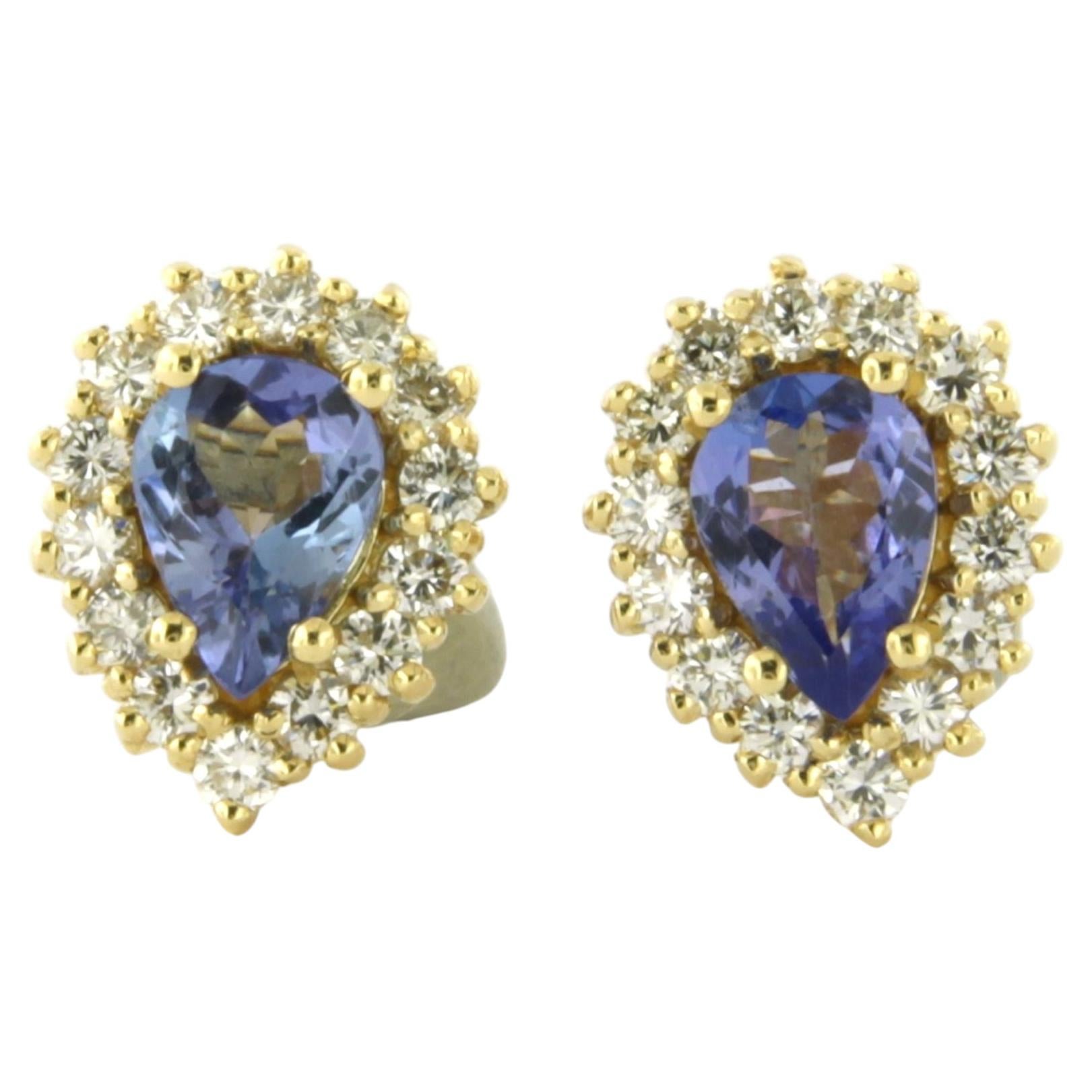 Earrings with tanzanite and brilliant cut diamonds up to 0.64ct 18k gold